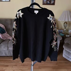 Crew neck black sweater perfect for the holidays with sequin embellishments